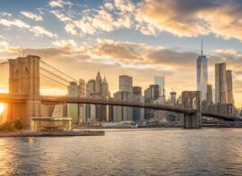 Brooklyn Bridge and Manhattan skyline at golden hour.
